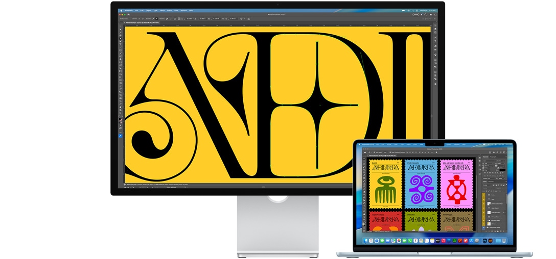 Studio Display и Mac лаптоп, показващ проект, върху който се работи с няколко Adobe програми. Studio Display показва близък план на черен текст на наситен жълт фон, а антирефлексното покритие спомага за намаляване на отблясъците.
