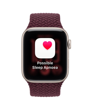 Apple Watch SE 3, screen shows possible sleep apnea notification, aluminium case, starlight colour, right side exterior, Digital Crown dial, connected to Braided Sport Loop strap, burgundy colour