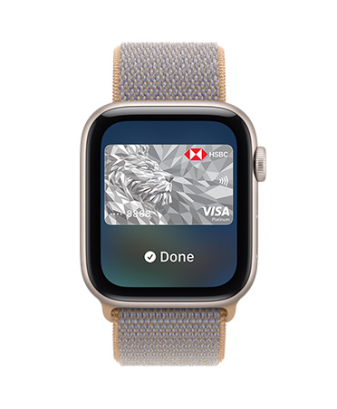 Apple Watch SE 3, aluminium case, starlight colour, screen shows Wallet, payment card graphic, right side exterior, Digital Crown dial, Sport Loop band, chambray blue colour (light blue-gray)