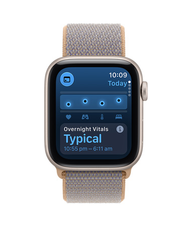 Apple Watch SE 3, screen shows overnight vitals, aluminium case, starlight colour, right side exterior, Digital Crown dial, connected to Sport Loop band, chambray blue colour (light blue-grey)